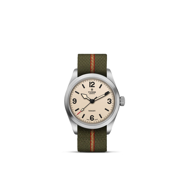 Reloj TUDOR Ranger con esfera crema y correa verde con rayas rojas y amarillas
